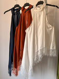 Blusa encaje asimétrica